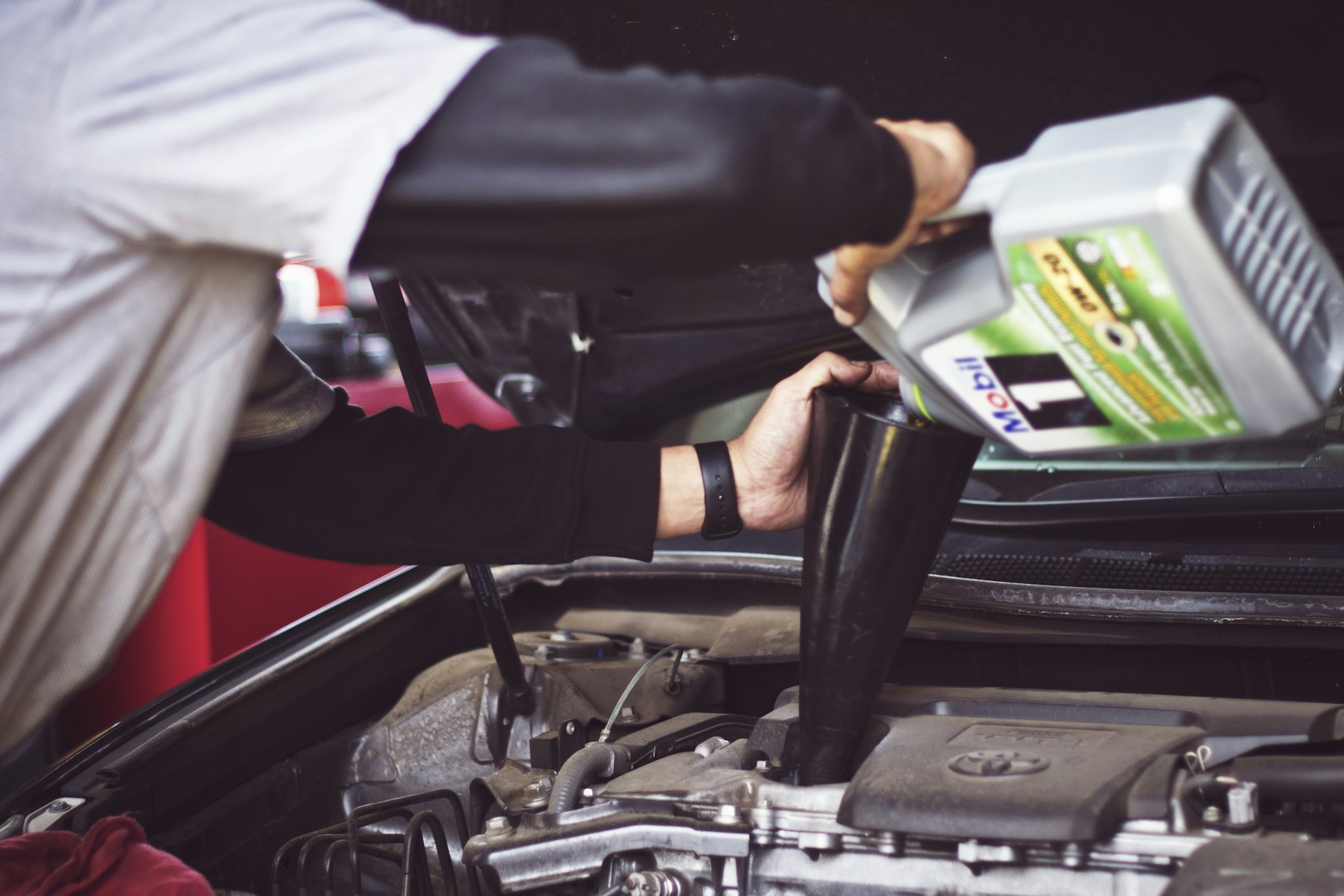 A specialist servicing a performance car